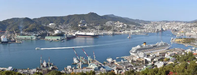 The harbor of Nagasaki with a cruise ship at the downtown pier