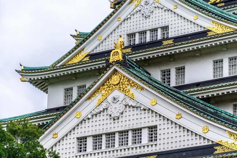 Osaka Castle keep rising above its stone walls and moat