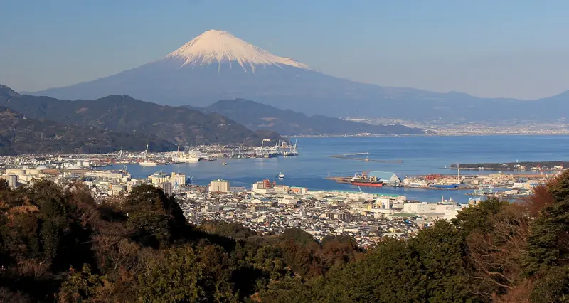 Mt. Fuji rising over the Port of Shimizu at dusk