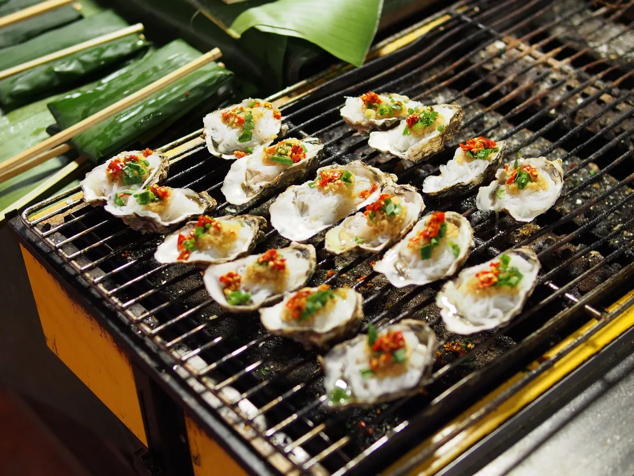 Oysters grilling in the shell at a Hiroshima stall