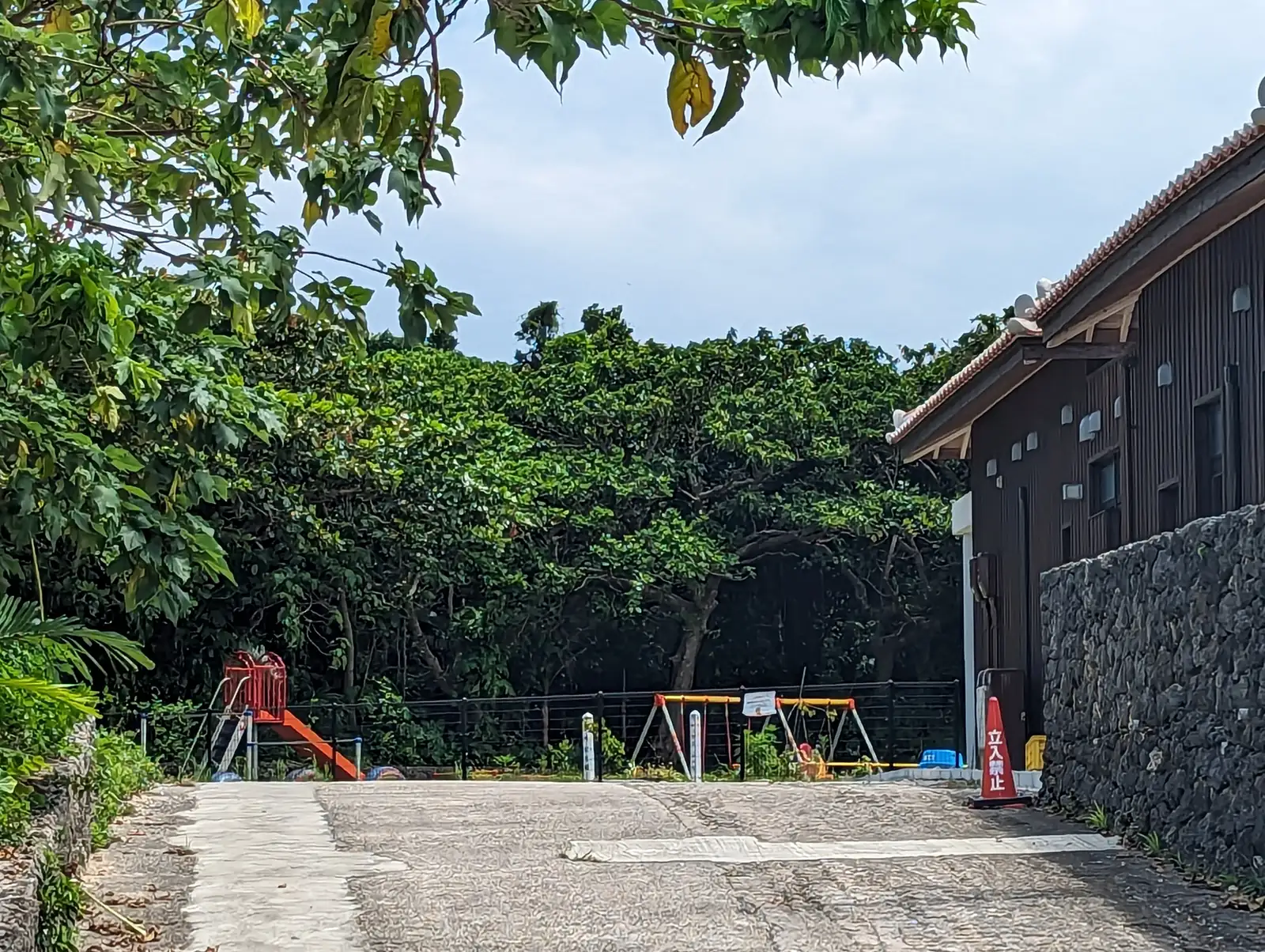 Coral walls and red-tiled roofs on Taketomi island
