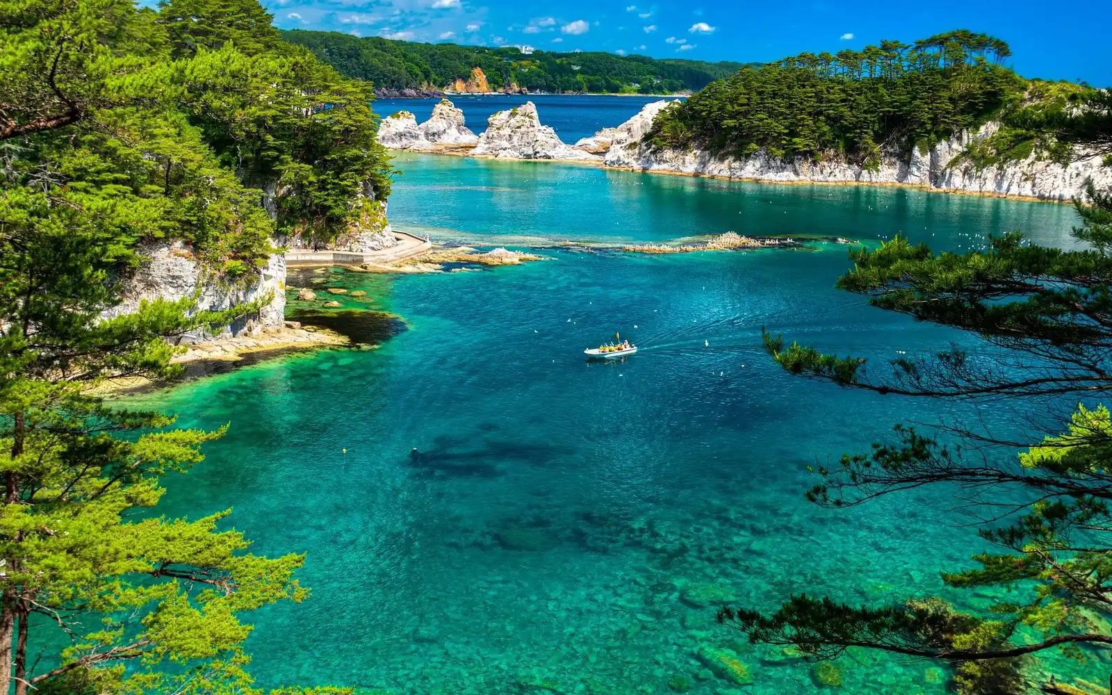 The white rhyolite spires and clear water of Jodogahama Beach in Miyako