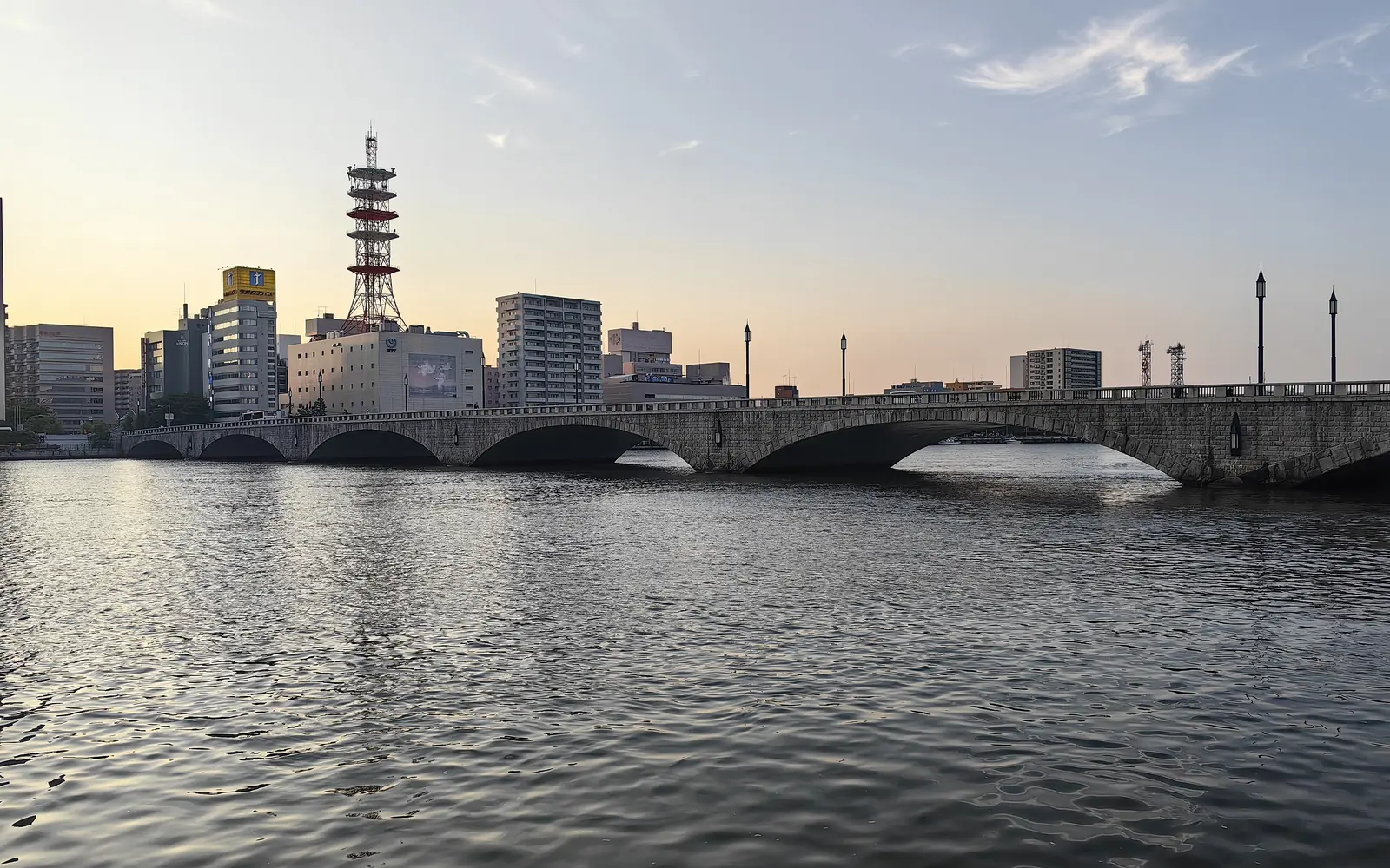 The six stone arches of Bandai Bridge over the Shinano River in Niigata at dusk