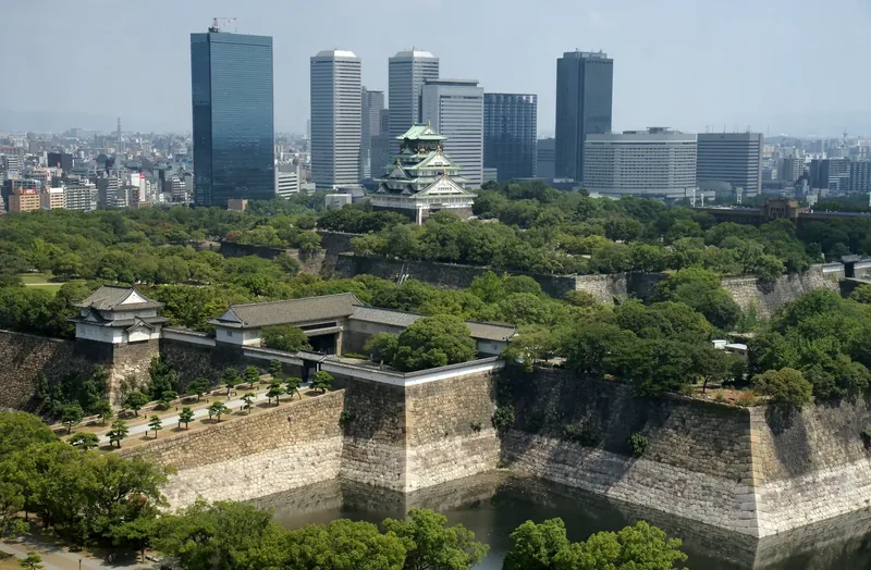 Osaka Castle keep rising above its stone walls and moat