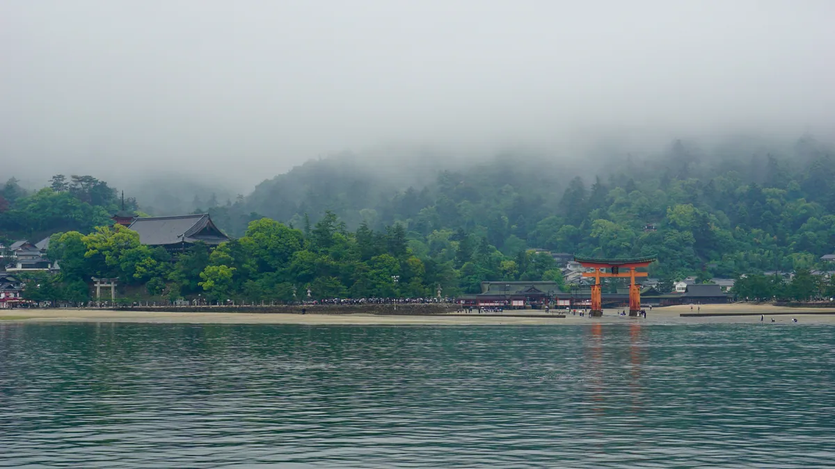 Itsukushima Shrine great torii in mist Miyajima
