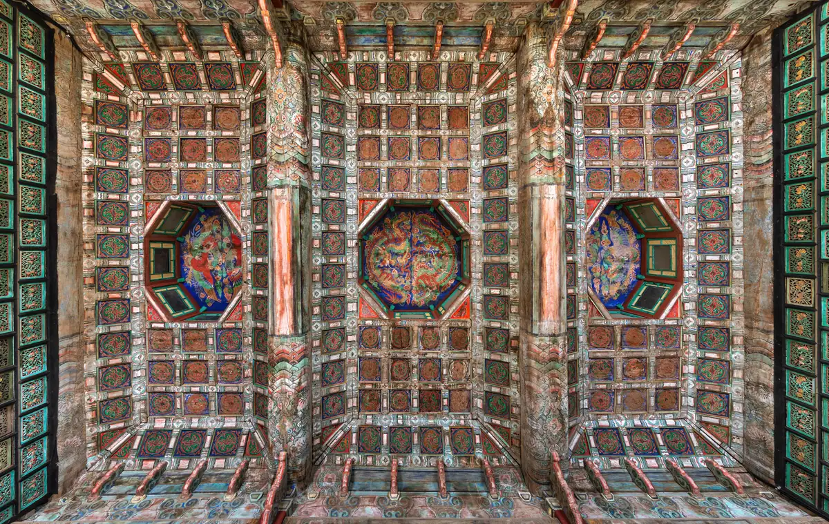 Finely painted wooden ceiling of Jibokjae Hall seen from below at Gyeongbokgung Palace in Seoul