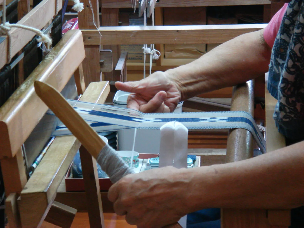 Weaving a MINSAH belt at Taketomi-jima Okinawa Japan