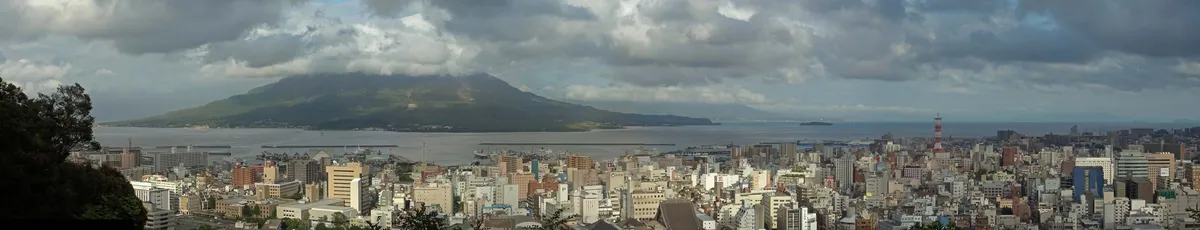 Sakurajima from the Shiroyama observatory, across the city