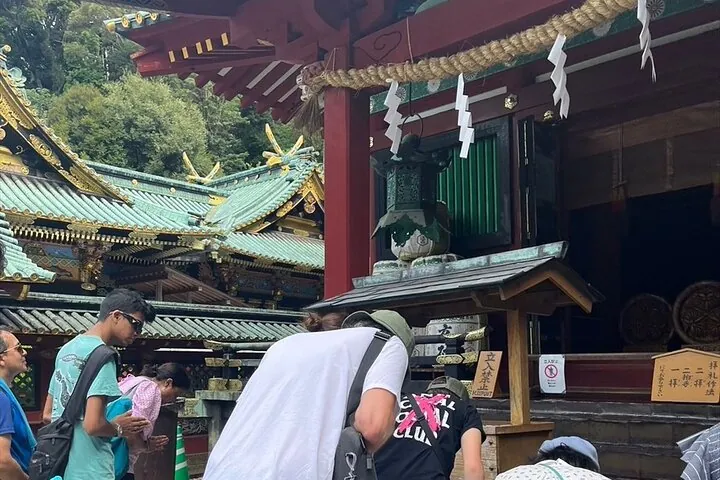 Family paying respect at Knozan toshougu Shrine-a moment of tradition and peace in Shizuoka.